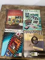 Front covers of all four spiral-bound scrapbooking books