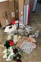 Entire lot laid out showing boxes of LED trees, wrapping paper, ornaments, lights, snowflakes, faux snow items