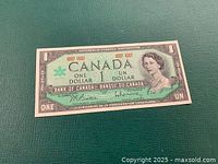 Front view of 1967 Centennial $1 note showing design details and condition