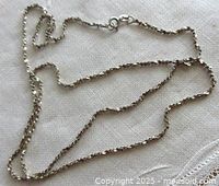 Full view of sterling silver chain laid flat