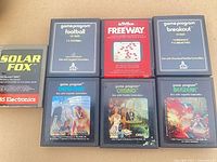 All seven Atari 2600 cartridges front view