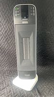 Front view of De'Longhi ceramic tower space heater on base