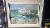 Full view of framed seascape painting