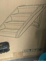 Factory sealed carton front showing product illustration of four-step ladder