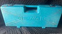 Closed teal Makita hard case front view