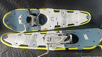 Top view of both Tubbs Frontier snowshoes showing bindings and deck