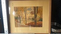Front view of framed autumn landscape artwork