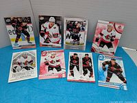 First image showing 8 Senators cards on blue background