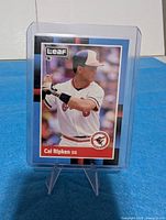 Front of 1988 Leaf #100 Cal Ripken Jr. card in plastic holder on stand