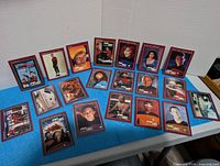 First group of Star Trek TNG trading cards laid out, showing fronts