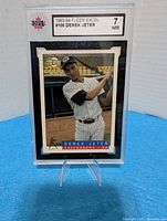 Front of encapsulated Derek Jeter card showing Fleer Excel design and KSA grade 7 label