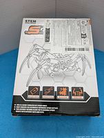 Front of boxed STEM spider robot kit showing illustration and features