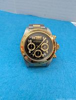 Front view of Invicta wristwatch showing dial details and two-tone design