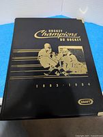 Front cover of black Hockey Champions 1993-94 binder