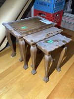 Three nested wood tables showing tops, legs and scale