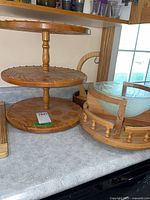 Overview of all wooden serving pieces on countertop