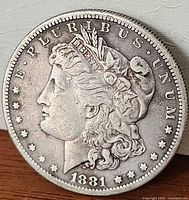 Obverse of 1881 Morgan Silver Dollar showing Liberty head and date