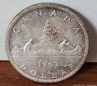 Reverse view showing CANADA, canoe design, date