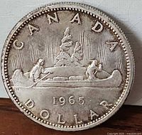 Reverse side showing Voyageur design and 1965 date