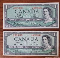 Both 1954 $1 banknotes front view showing portrait, serials, signatures