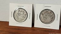 Both 1943 and 1951 Canadian 50-cent coins in holders