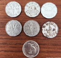 Group shot of all seven Canadian nickels