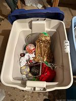 Overview of Rubbermaid bin with contents