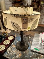 Full view of lamp showing shade pattern, base style, missing finial