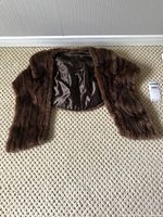 Full view of brown mink stole laid flat, exterior fur visible