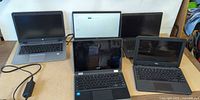 Group shot of all five laptops on table