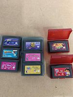 All eight cartridges in open storage cases