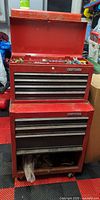 Full view of red Craftsman top and bottom tool chests on casters