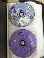 Knockout Kings 2000 and Cyber Sled discs in binder sleeve