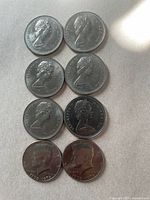 Eight coins arranged in two columns showing obverse sides
