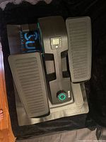 Top view showing full Cubii elliptical on mat, pedals, display.