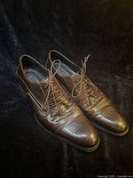 Three-quarter view of both shoes showing texture and lacing