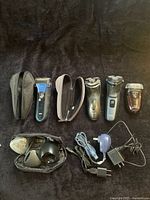Group shot of four shavers, chargers and accessories