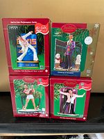 Group shot of all four boxed Elvis musical ornaments