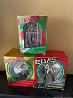 Group shot of three boxed Carlton Cards Elvis ornaments