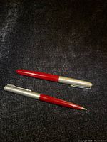 Fountain pen and pencil side by side showing overall form and color