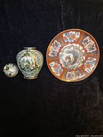 Group shot showing lidded vase (lid off) and decorative plate