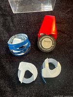 Label maker and three tape rolls displayed