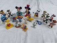Group shot of all figurines on white cloth