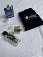 Full set showing lamp, refill bottle, pouch, funnel, burner