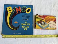 Somerville Bingo box next to Pocket Chess & Checkers box with measuring tape