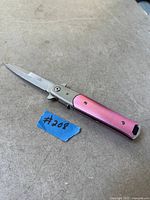 Knife open showing blade and handle