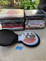 Full lot with two stacks of DVD cases and disc wallet