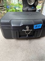 Front view closed showing lock, keys, handle and SentrySafe logo