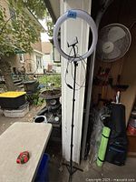 Full view of tripod with ring light and corded controller