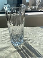 Full view of clear crystal vase showing vertical panel cuts and form